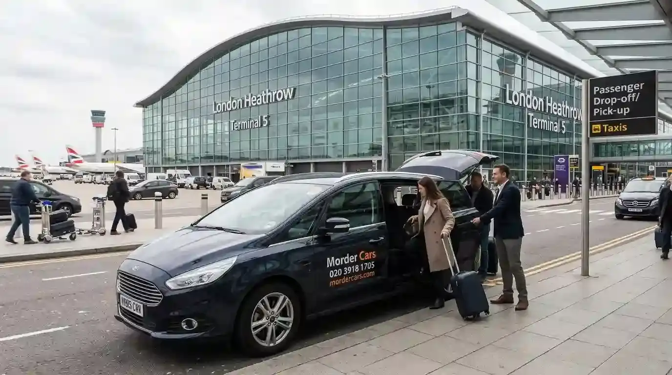 Minicab collecting passengers with luggage outside a Heathrow terminal